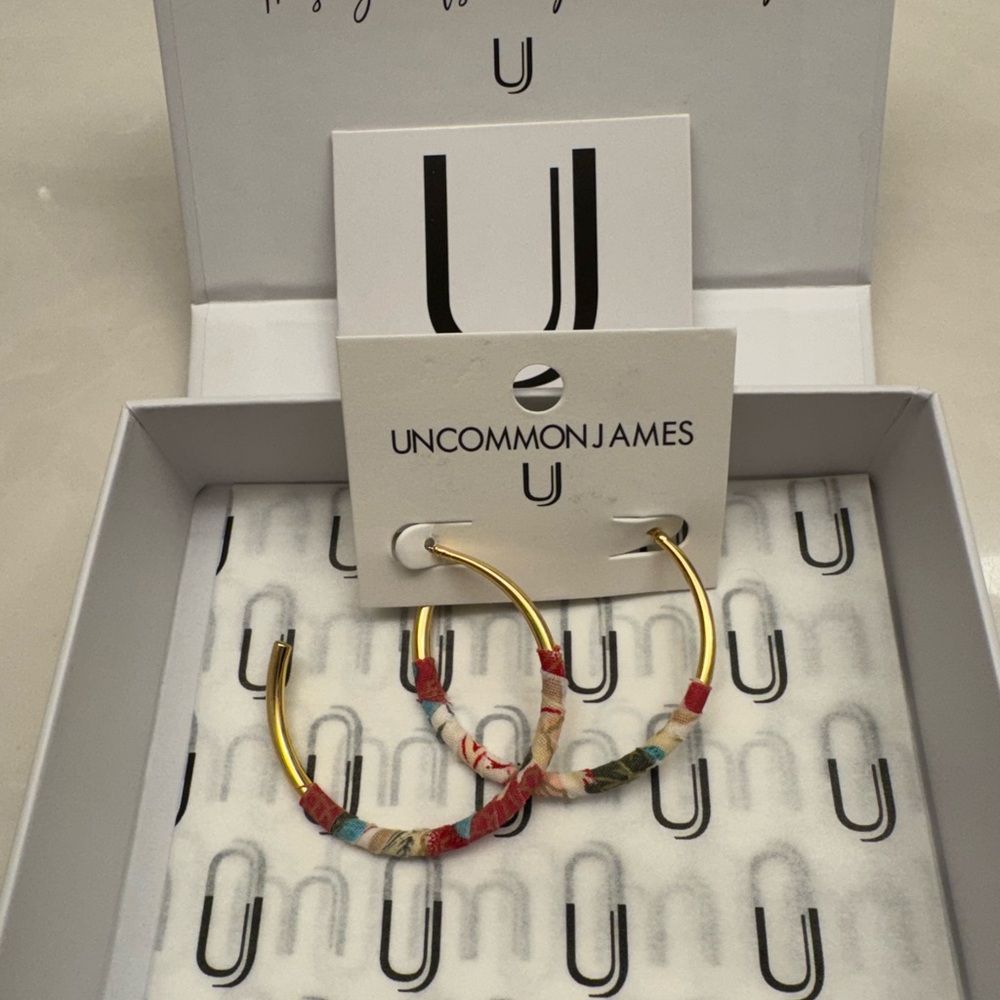 Uncommon James gold with fabric wrap hoop earrings.
